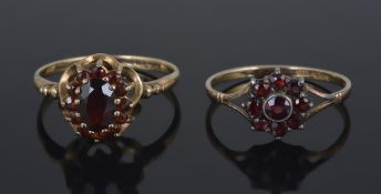A gold mounted Bohemian garnet set daisy cluster ring,