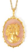 A large contemporary gold and diamond cameo style portrait pendant mounted on rose quartz