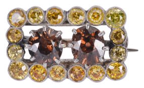 An unusual yellow and cinnamon fancy diamond rectangular brooch
