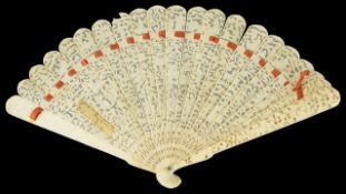 A carved late 19th century Chinese ivory fan