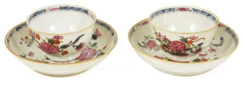 A pair of Chinese 18th century famille rose tea bowls and saucers