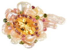 An unusual Continental gold mounted baroque pearl and coloured gem floral brooch