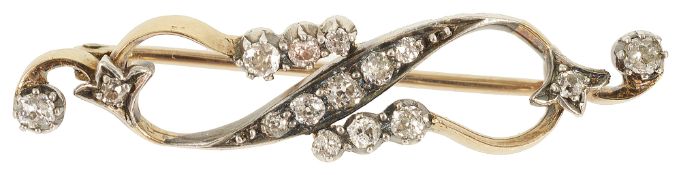 A delicate diamond set ribbon scroll brooch, circa 1900
