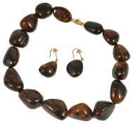 A treacle coloured young amber bead necklace and ear drops