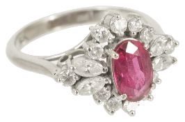 An attractive Continental ruby and diamond oval fancy cluster ring