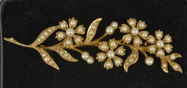 A Victorian pearl set floral spray brooch