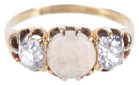 A large Victorian precious opal and diamond three stone ringthe central circular opal set between