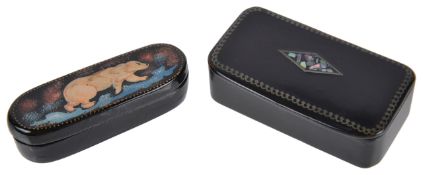 Two paper mache snuff boxesthe first a Russian box of elongated oval form decorated with polar bear,