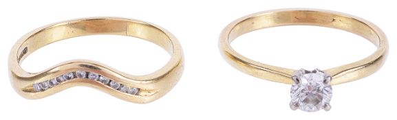 A single stone diamond set ring together with another diamond ringthe single stone approximately 0.