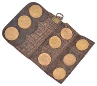 A coin wallet containing three full fine gold sovereigns and six half sovereignscomprising three
