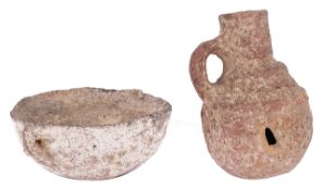 Antiquities; a small Cypriot two handled pottery bowl and a similar round bottomed bottle, each