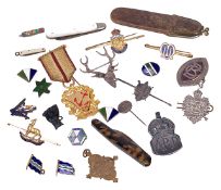 A collection of military and civil badges and insignias and othersincluding a silver London Rifle