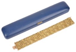 A very heavy 18ct gold articulated panel braceleteach panel fitting invisibly to the next, the whole