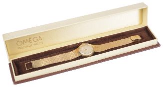 An 18K Omega ladies manual wind wristwatchthe circular champagne dial with baton and numerical