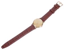 An Omega 14K gold gentleman's wristwatchthe circular champagne coloured dial with baton hours with