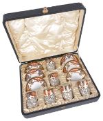 A Royal Crown Derby set of six silver mounted coffee cups and saucers