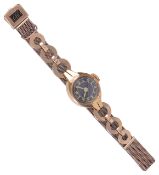 A 18ct gold ladies wristwatchthe circular black dial with gilt Arabic hours and facetted hands in