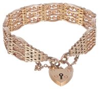 A fancy gold four bar gate bracelet with heart padlock fasteningthe bracelet of substantial