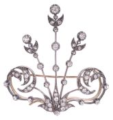 A Victorian diamond set aigrette brooch of stylised foliate design having three central diamond