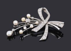 A good quality Continental diamond and pearl cocktail spray brooch, circa 1950formed as ribbon