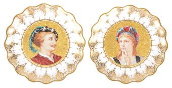 A pair of porcelain portrait plates, of scallop form with central painted portraits