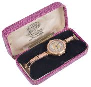 A 9ct Bravingtons gold ladies wristwatch, the engine turned gilt dial with arabic hours, spade