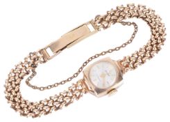 An Accurist 9ct gold ladies wristwatchthe circular dial with baton hours and facetted hands, in a