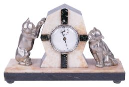An Art Deco clockcentral clock in an alabaster and marble surround, flanked by two playful cats upon