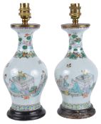 A pair of Chinese 19th century famille verte baluster vases converted to lampspainted with a