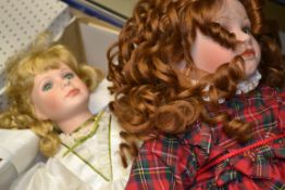 A collection of assortment of porcelain faced doll