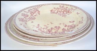 A graduating set of four 19th century Wedgwood Clematis pattern meat platters together with a