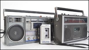 A vintage / retro JVC Ghetto blaster together with an original Sony Walkman personal music system