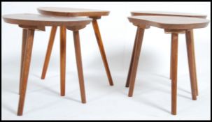 A set of four beech kidney shaped mid 20th century occasional side tables / coffee tables raised