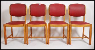A set of four Art Deco dining chairs ' Talent ' by H Marshall and Co having red leatherette