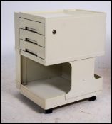 A contemporary 20th century Neolt style ' bobby ' trolley having pedestal square shaped