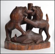 A fantastic wooden  carved figure group of two mal