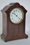 An Edwardian mahogany mantle clock having a cylind