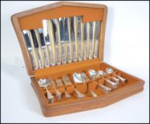 A cased canteen of cutlery complete with lining and set in the original presentation box  ( see