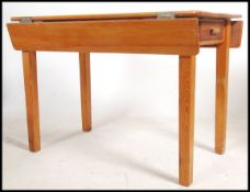 A mid century solid pine Air Ministry type drop le
