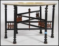 A Colonial Indian brass top folding / metamorphic