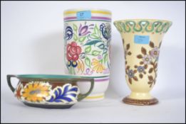 Ceramics to include a vintage Poole Pottery vase of large form along with two Gouda floral pieces,