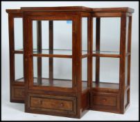 An early 20th century mahogany shop display counter cabinet. The cabinet with breakfront centre