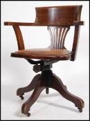 A 1930's solid oak Industrial captains office swiv