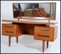 A 1970's retro teak wood G-Plan suspension set dre