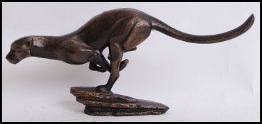 A vintage style, 20th century cast iron figure of a Cheetah. Measures 28cms wide.