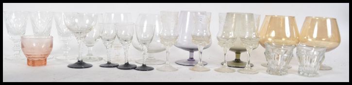 A collection of 20th century glasswares to include sherry glasses with acid etched examples, lustre,