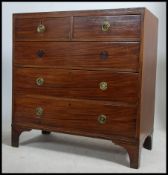 A Georgian 19th century mahogany inlaid chest of drawers being raised on bracket feet with 2 short