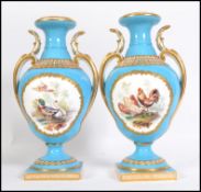 A pair of late 19th century continental urns in the manner of Dresden / Meissen.  Both have good