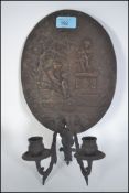 An early 19th century cast bronze wall sconce plaq