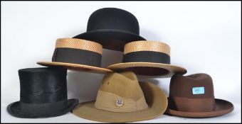 A collection of vintage gentleman's hats to include straw boaters, top hat, bowler, Australian